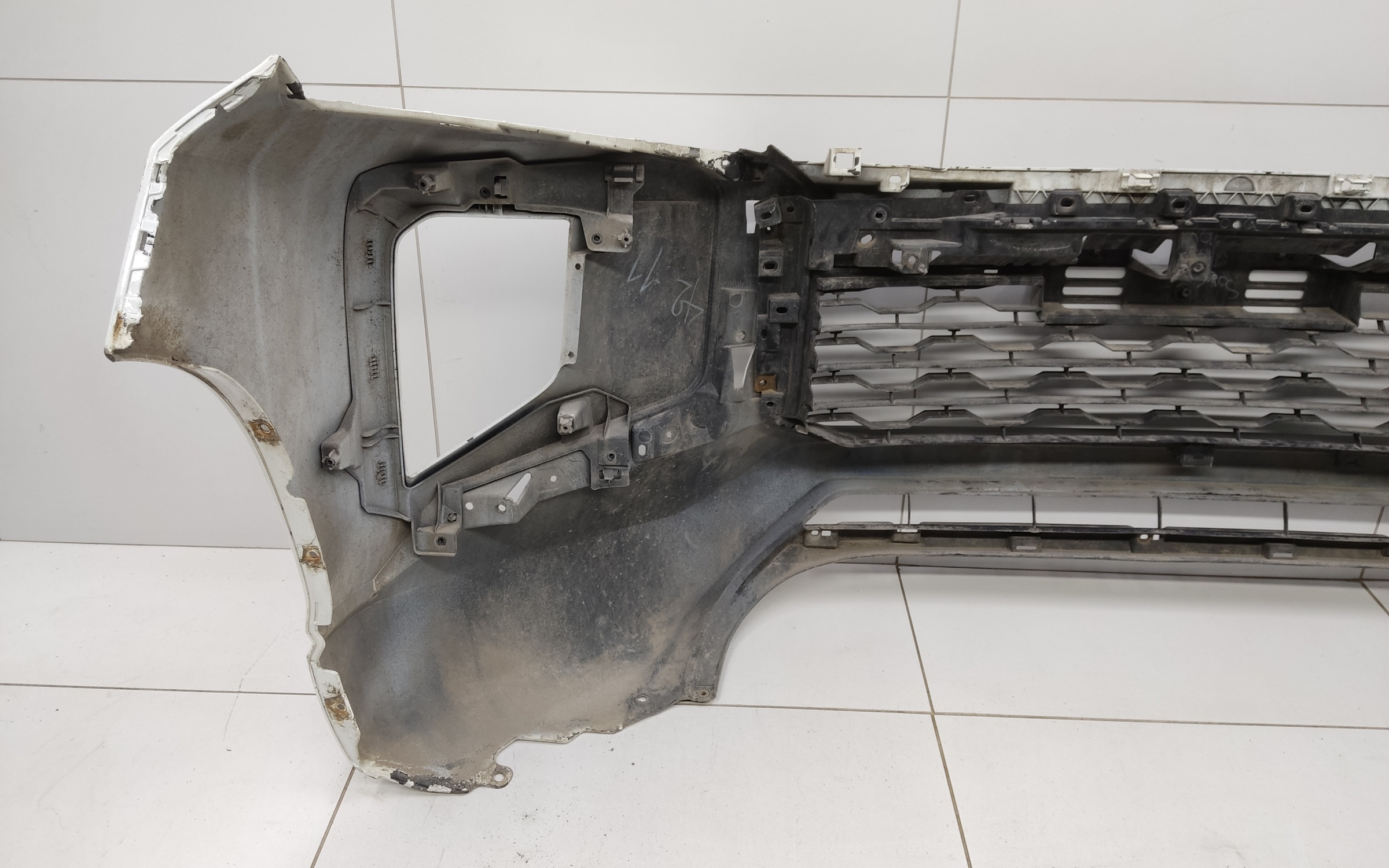 Бампер передний Mitsubishi L200 5 Restail