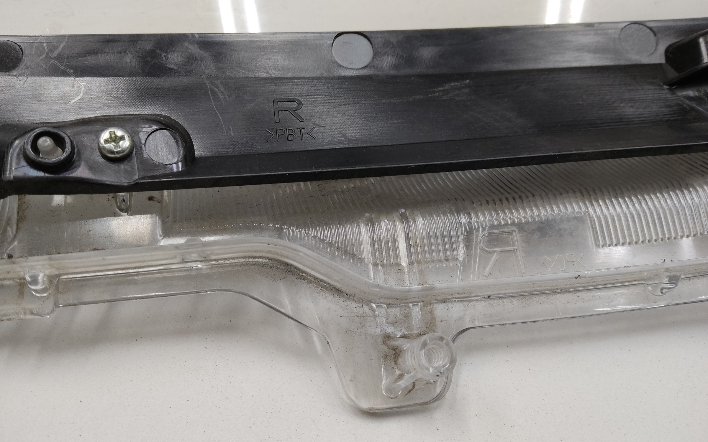 Стекло фары передней правой Toyota Corolla E210