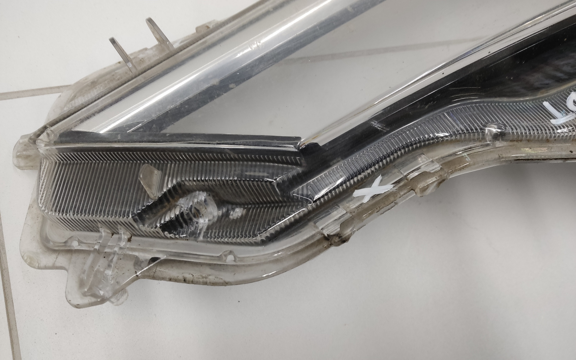 Стекло фары передней правой Toyota Corolla E210