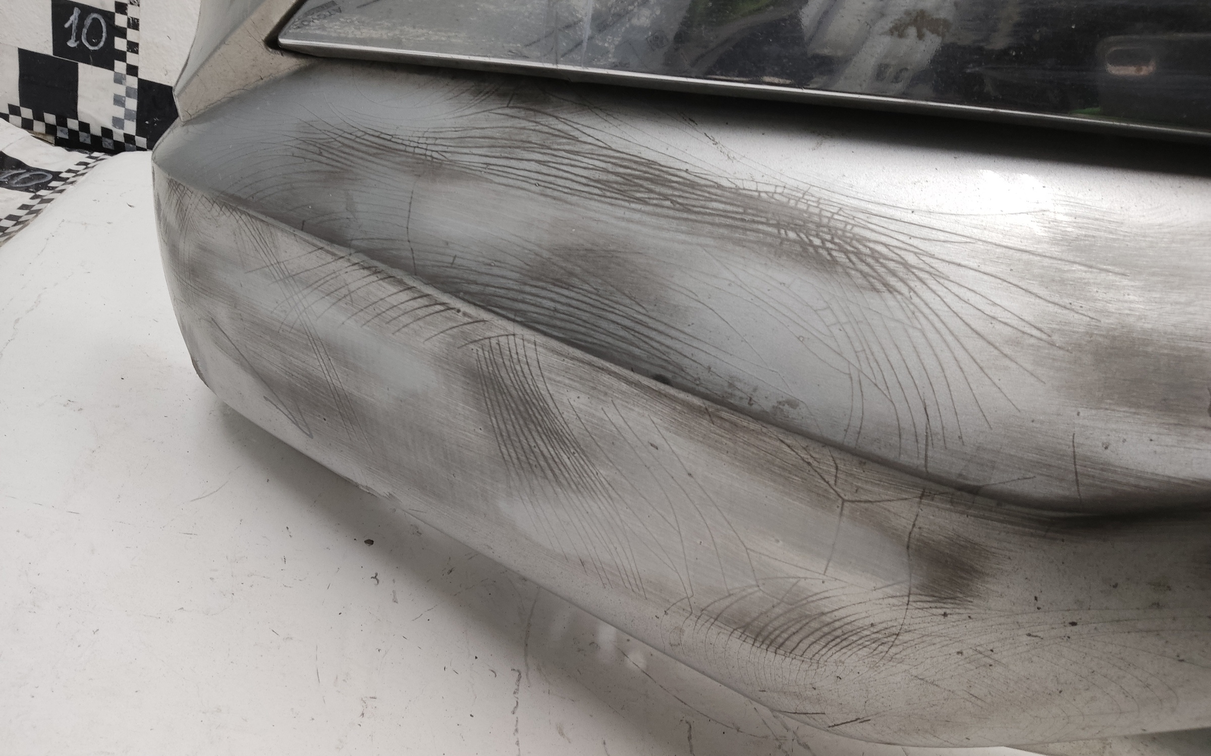 Бампер передний Mitsubishi L200 5 Restail