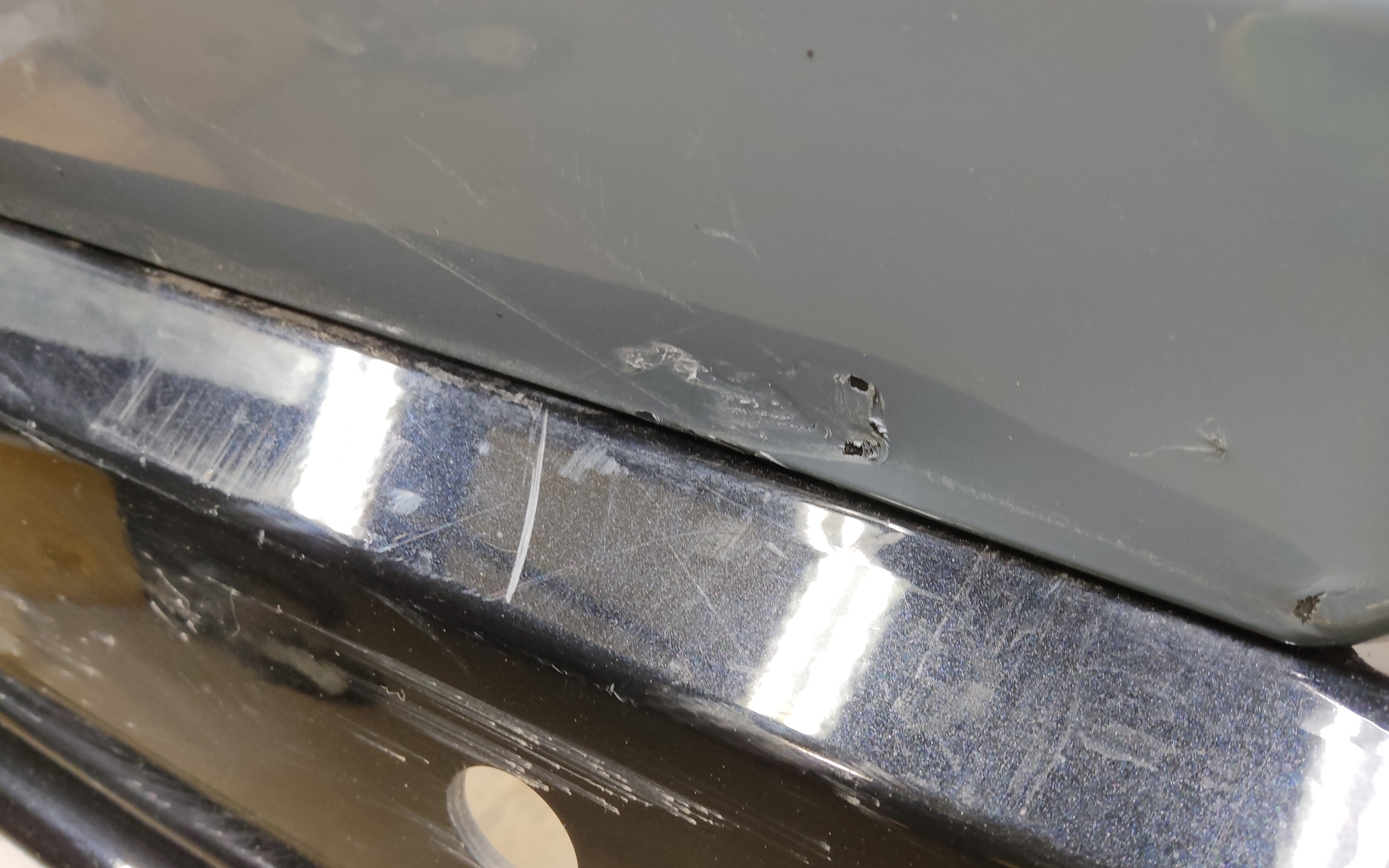 Бампер задний верхняя часть Geely Tugella