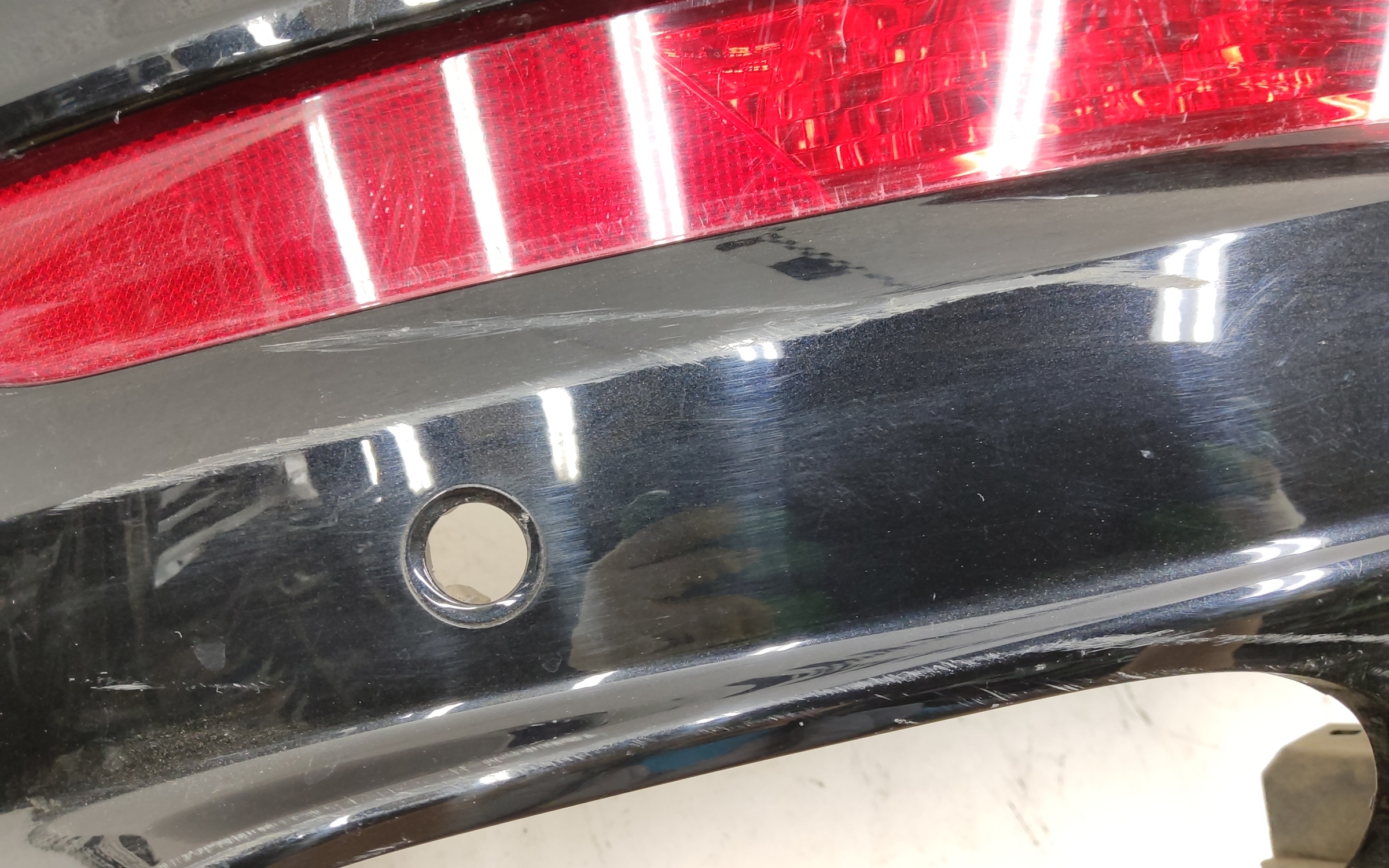Бампер задний верхняя часть Geely Tugella