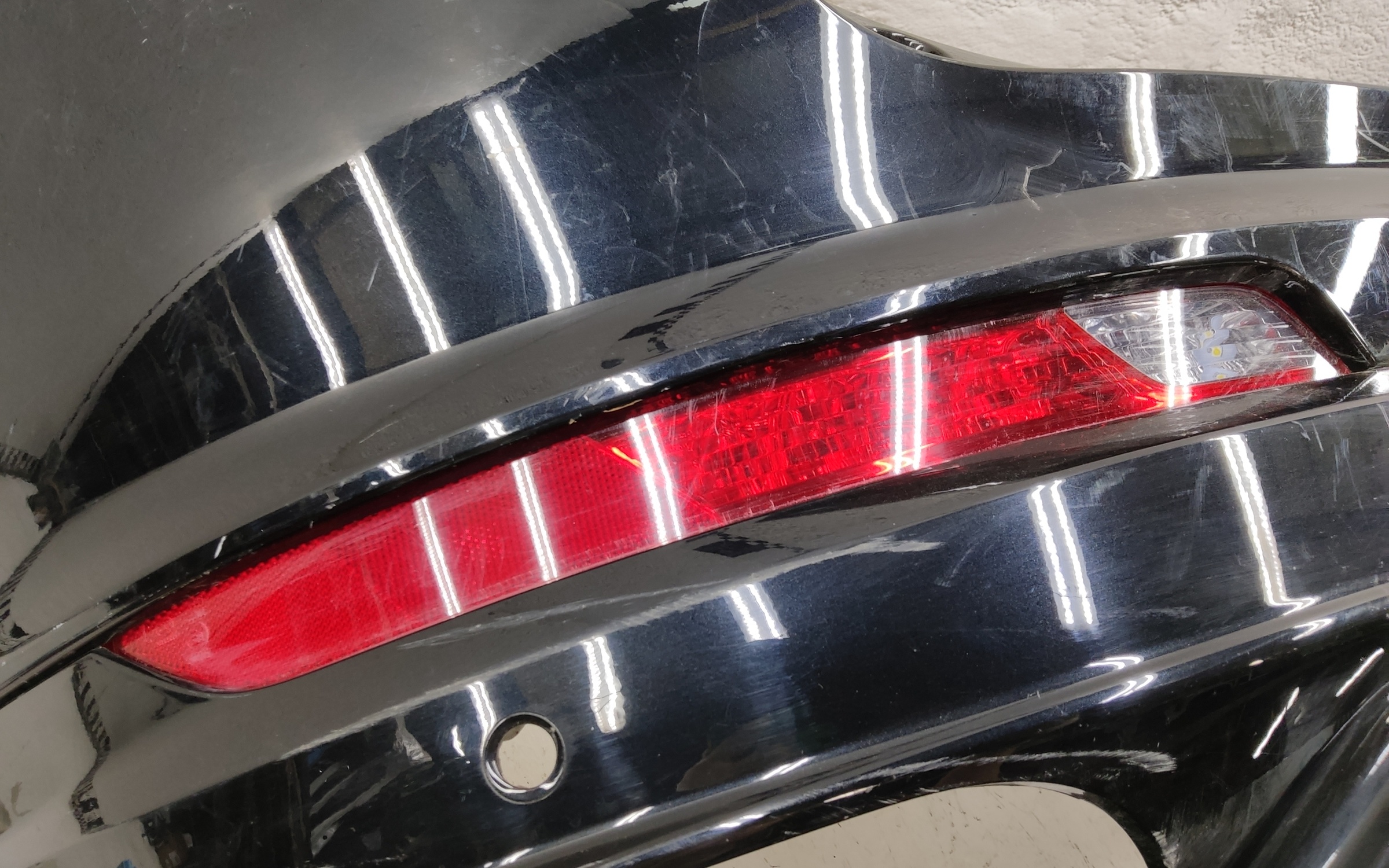 Бампер задний верхняя часть Geely Tugella