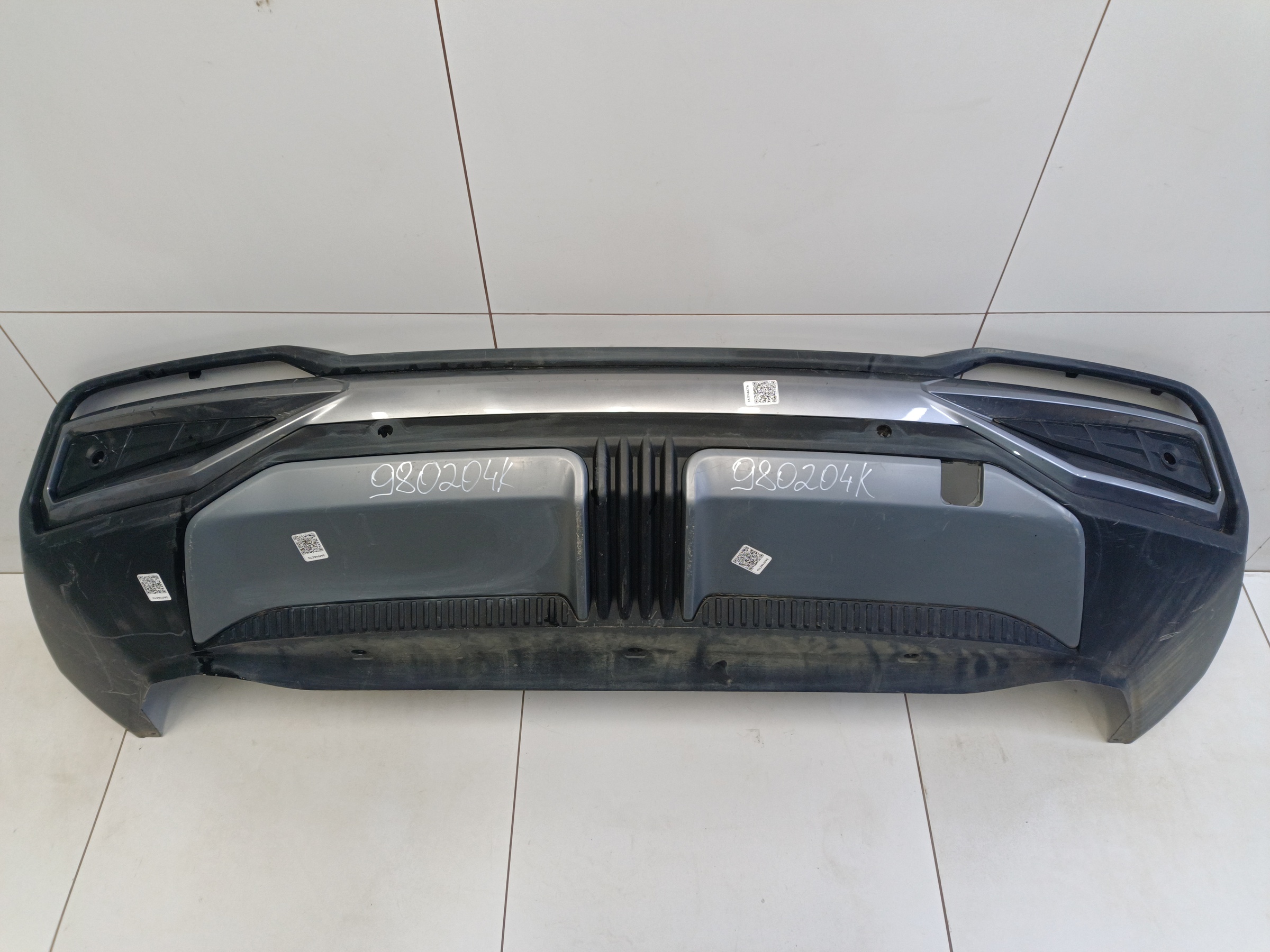 Юбка заднего бампера Geely Atlas 2