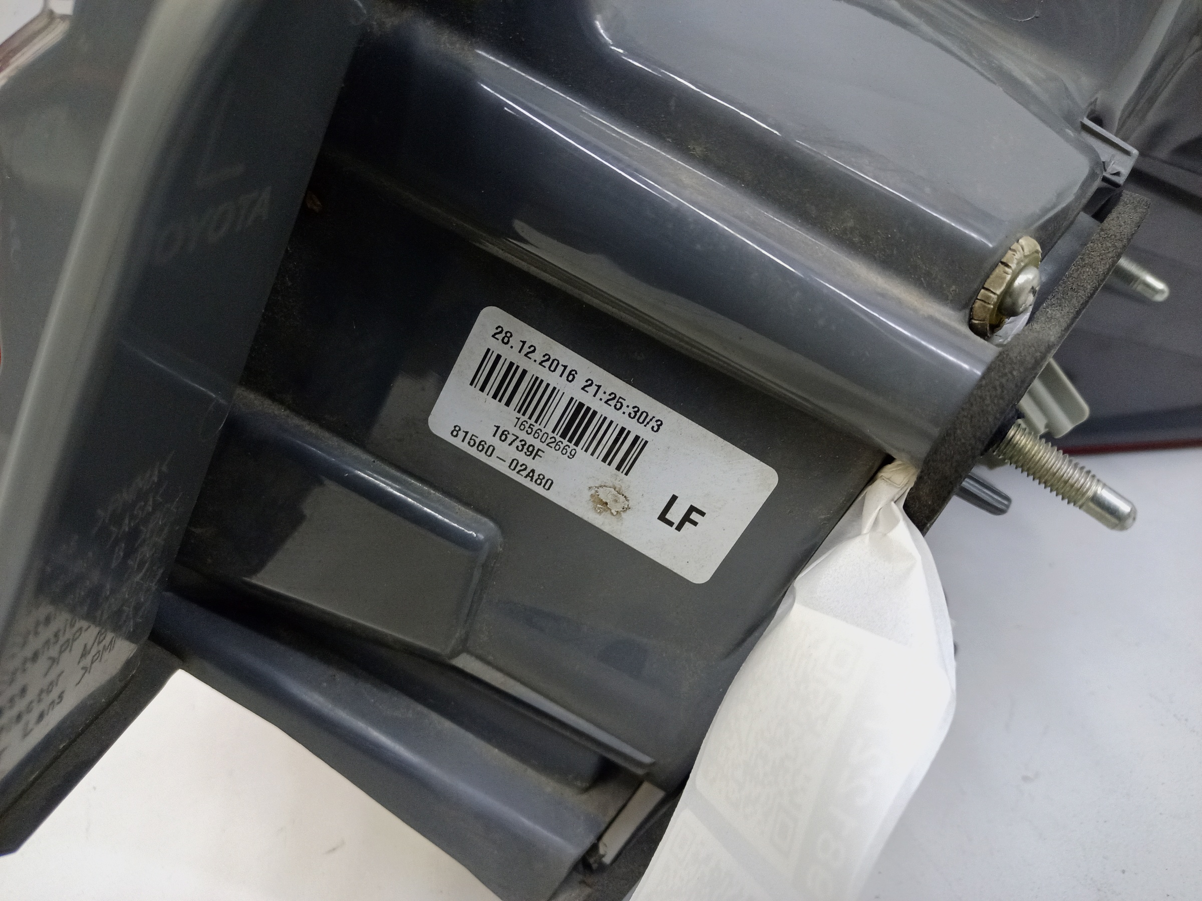 Фонарь задний левый наружный Toyota Corolla E180