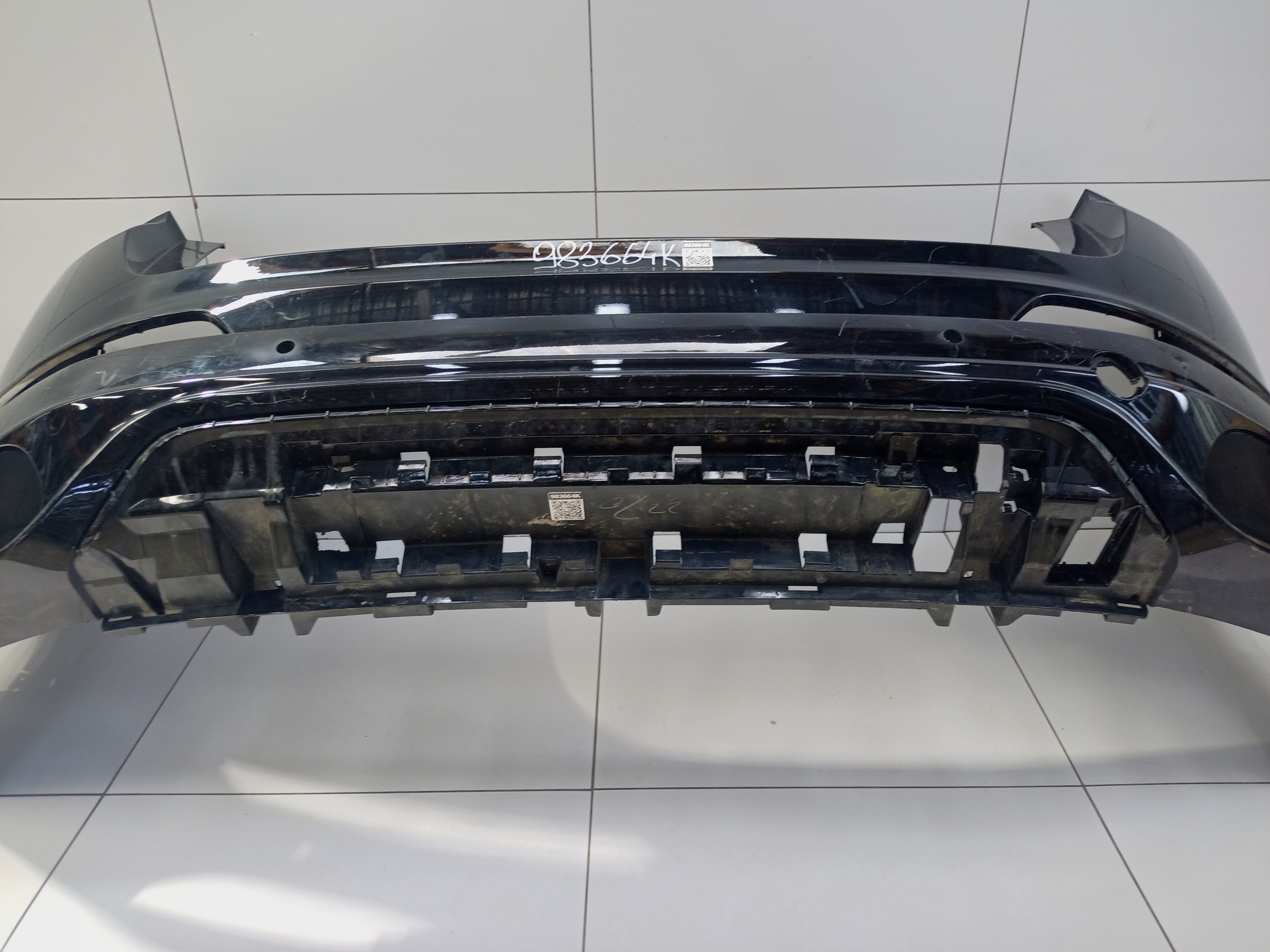Бампер задний верхняя часть Geely Tugella