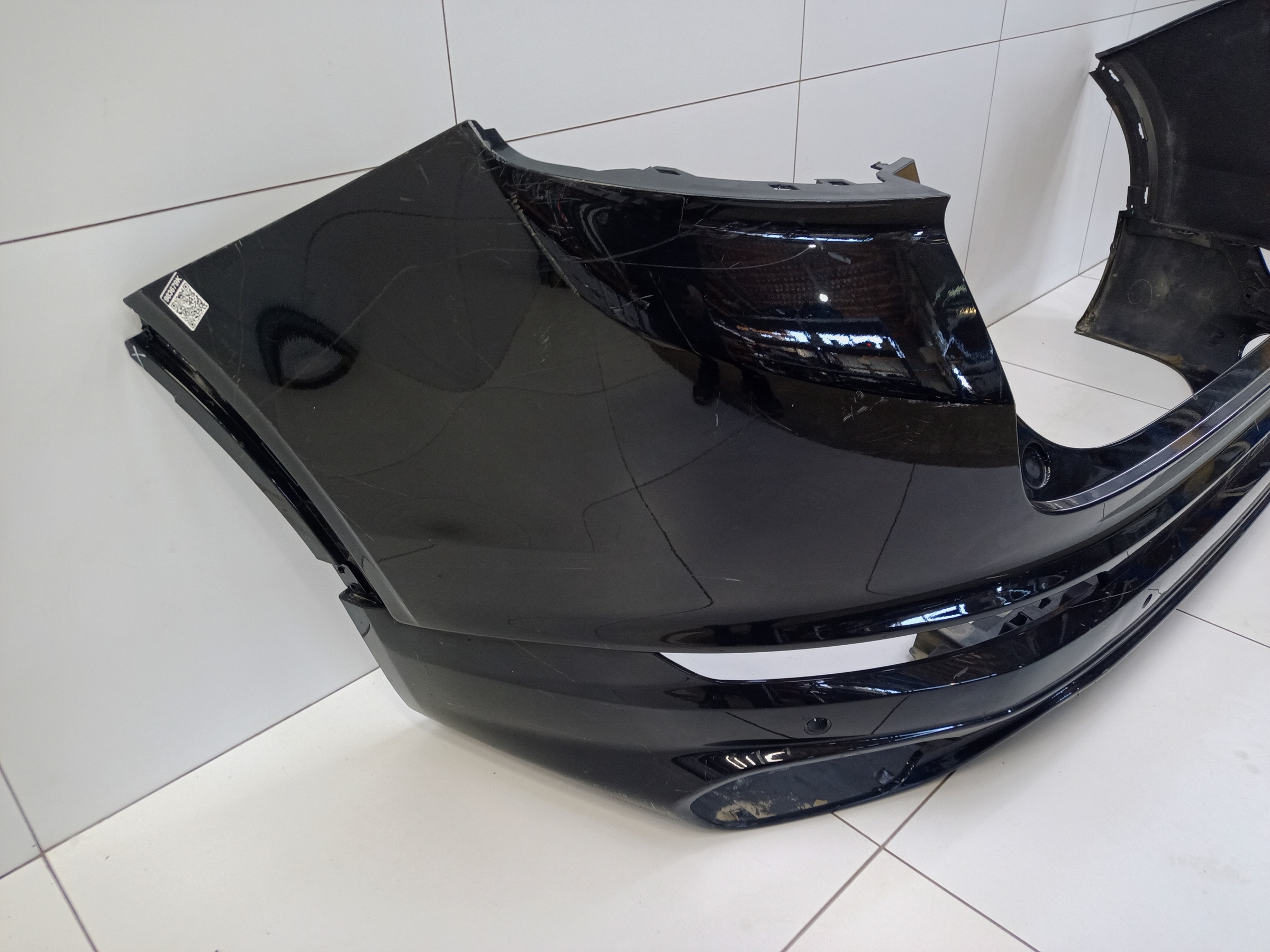 Бампер задний верхняя часть Geely Tugella