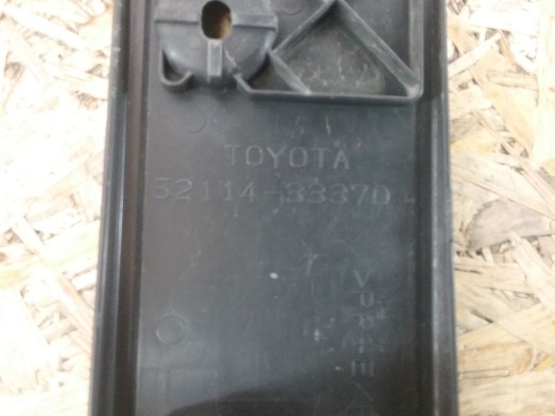 Накладка переднего бампера под номерной знак Toyota Camry V55